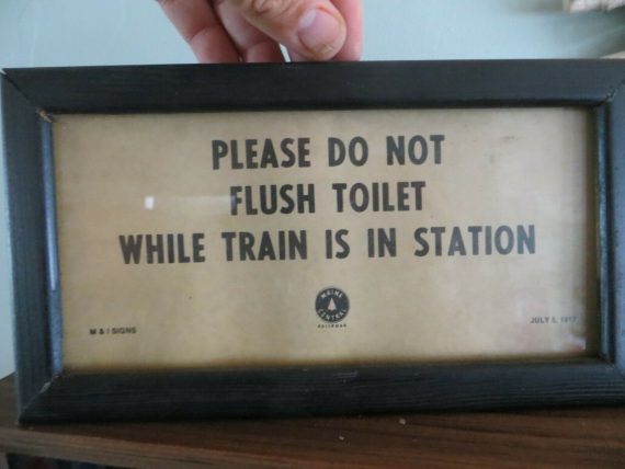 1917 MAINE CENTRAL PLEASE DO N OT FLUSH TOILET WHILE TRAIN IS IN STATION RR SIGN