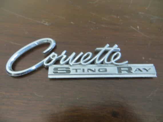 Corvette Sting Ray original car emblem P-3848316-C 4 1/2 X 1 1/4 INCHES CHROME