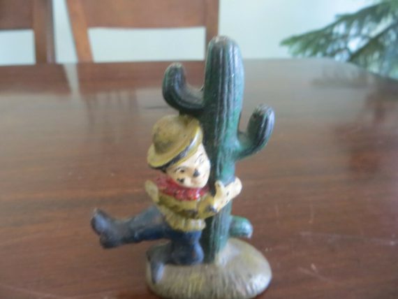 early 1930’s cast iron leprechaun cactus  figure beer soda bottle opener painted