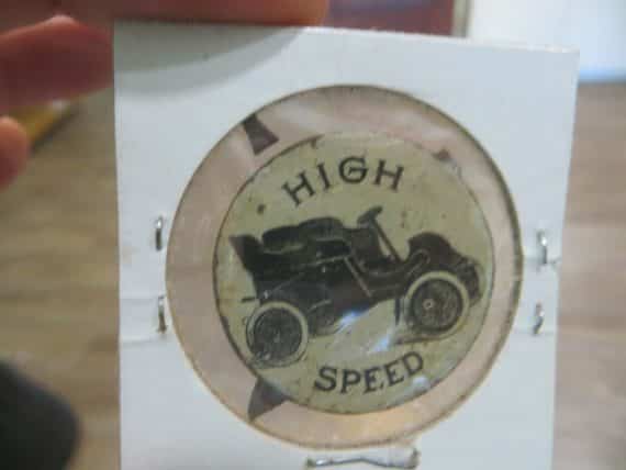 High Speed jalopy auto rare metal  100 year old  pictorial figural tobacco tag