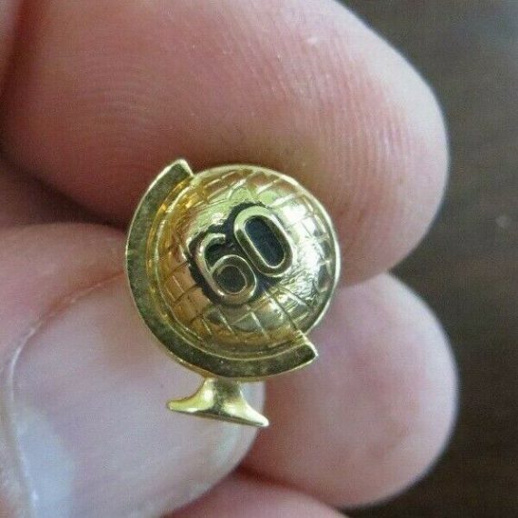 number 60 on world globe on axis gold tone lapel service or award years pin