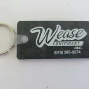 Wease Equipment Inc, advertising black rubber collectible key chain