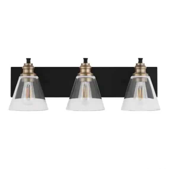 Hampton Bay 1012HBMBVBDI Manor 24 in. 3-Light Matte Black Industrial Bathroom Vanity Light with Vintage Brass Accents and Clear Glass Shades