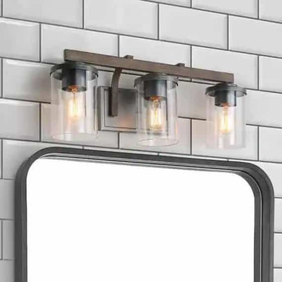 LNC A03409 Weyland Farmhouse 20 in. 3-Light Rust Black Bathroom Bar Vanity Light with Faux Wood Accents and Clear Glass Shades