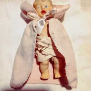 Rubber type Baby Doll stamped H D. Non jointed with molded on curls