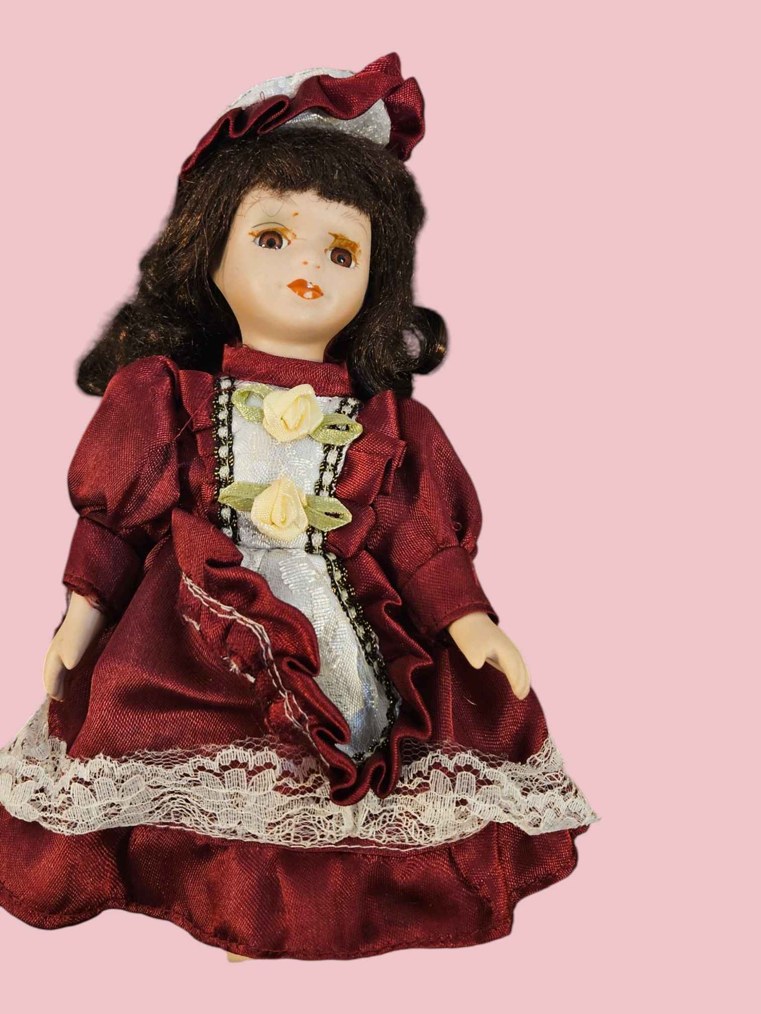Vintage Porcelain Doll with Brown Hair and Burgundy Dress — ITEM #3103