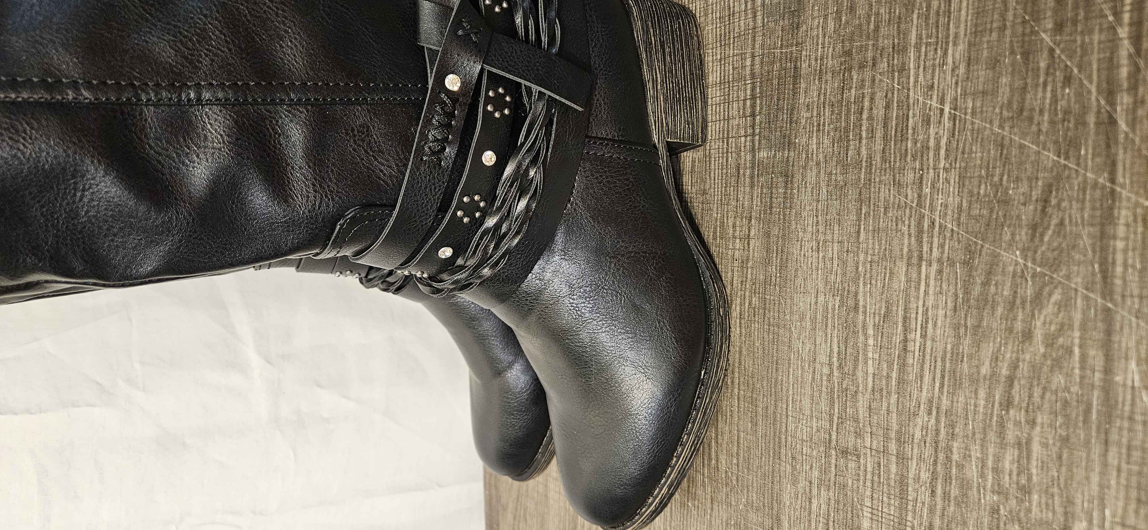 Women's Black Knee High Riding Boots, Size 6.5. Features braided and studded strap Details around the ankle. Inside Zip Up Closure. Excellent Used Condition ITEM #3469.